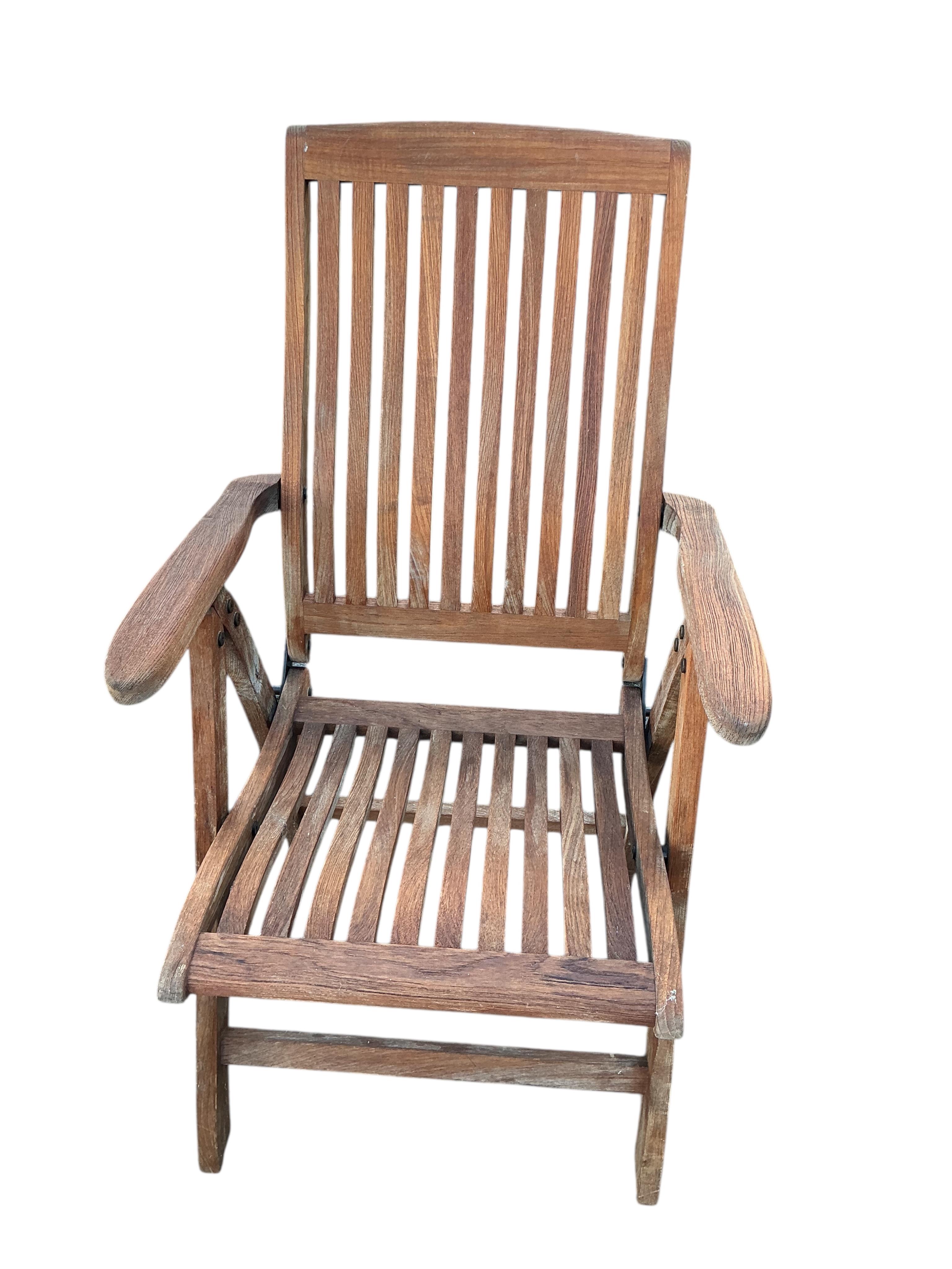 A set of four Winchester teak reclining garden armchairs